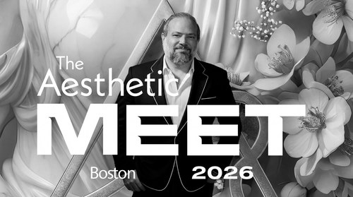 Dr. Frank Agullo, MD, FACS, double board-certified plastic surgeon, at The Aesthetic Meeting 2026 in Boston, in front of the The Aesthetic MEET Boston 2026 floral and gold branded backdrop, where he presented in the practice-management track on AI for reputation management.
