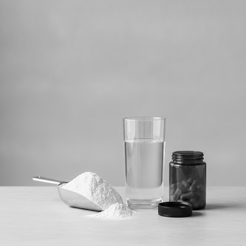 Black and white still life of a scoop of collagen powder beside a glass of water and a supplement jar. Commentary on collagen formats by Dr. Frank Agullo, MD, FACS.