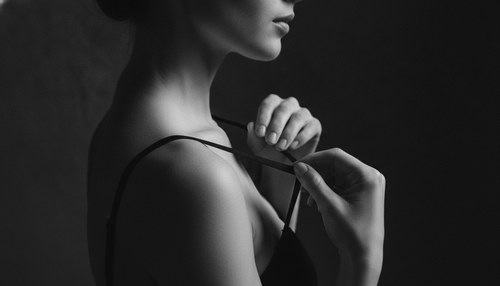 Greyscale editorial photograph for an auto augmentation breast lift essay by Frank Agullo, MD, FACS.