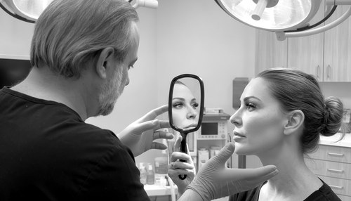 Greyscale editorial photograph for a destination rhinoplasty essay by Frank Agullo, MD, FACS.